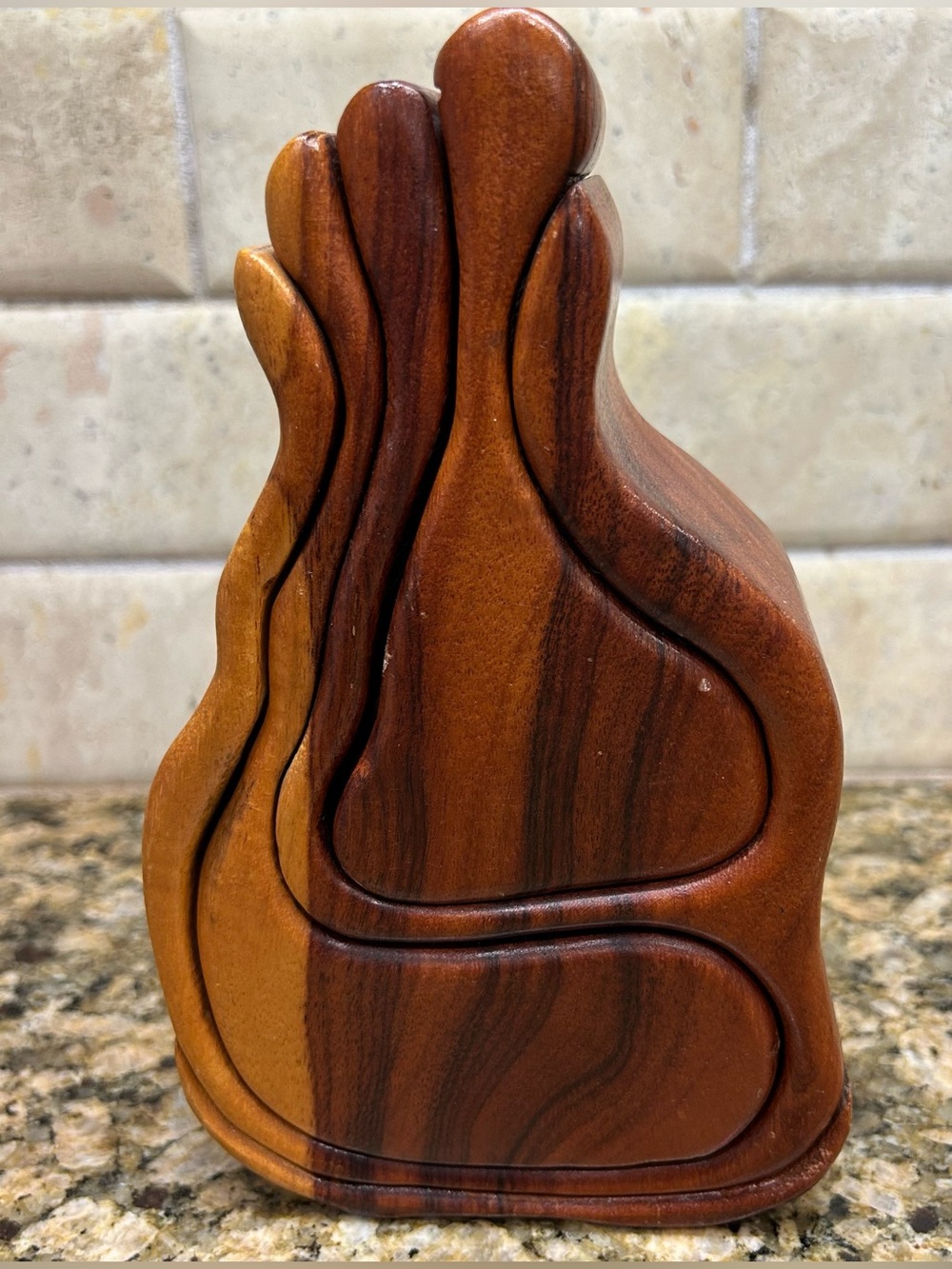 Wooden bandsaw puzzle box with two felt lined secret compartments that slide out